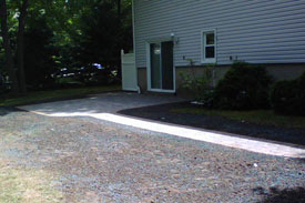 Back stone patio with walk.